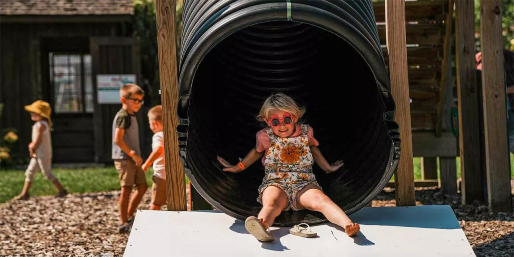 blonde girl on slide